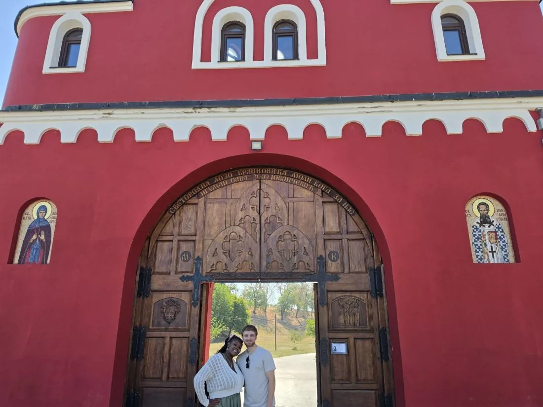 Guests at the red gate of Krušedol Monastery